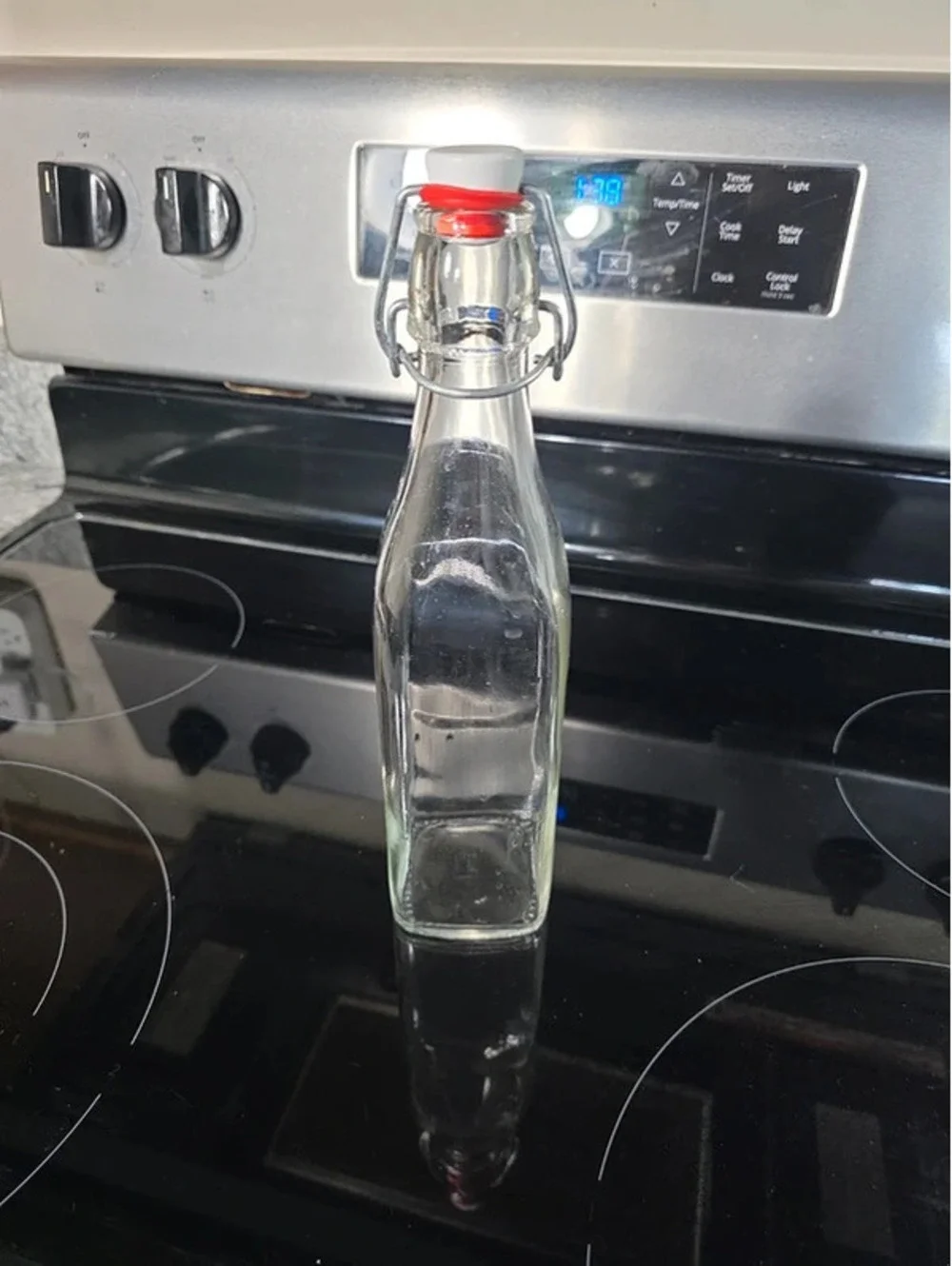 Clear Glass Bottle with Swing-Top Cap